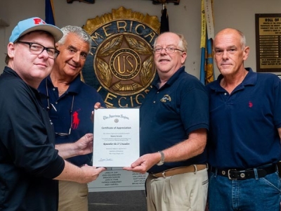 Remember the 27 Crusaders Director Sean Swords and Producer John Ricuitti accept Certificate of Appreciation from Bob Cummings and Commander Bruce Conklin